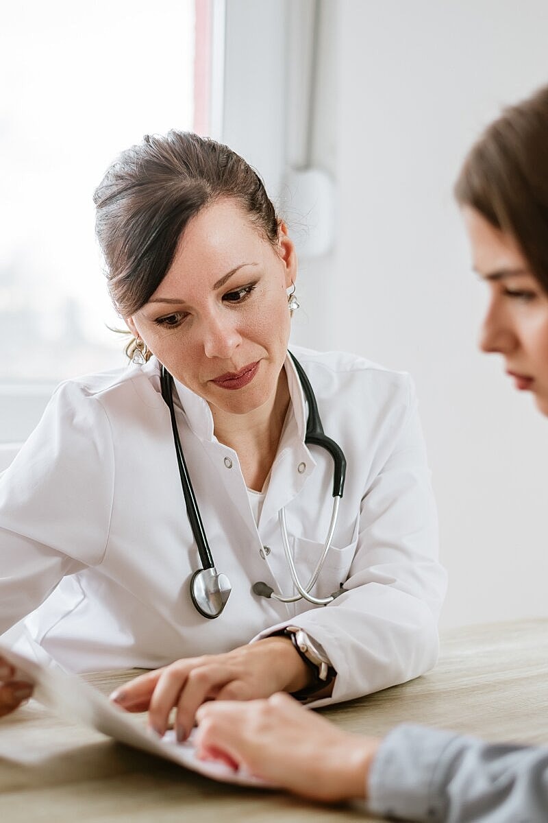 two women holding each other on couch