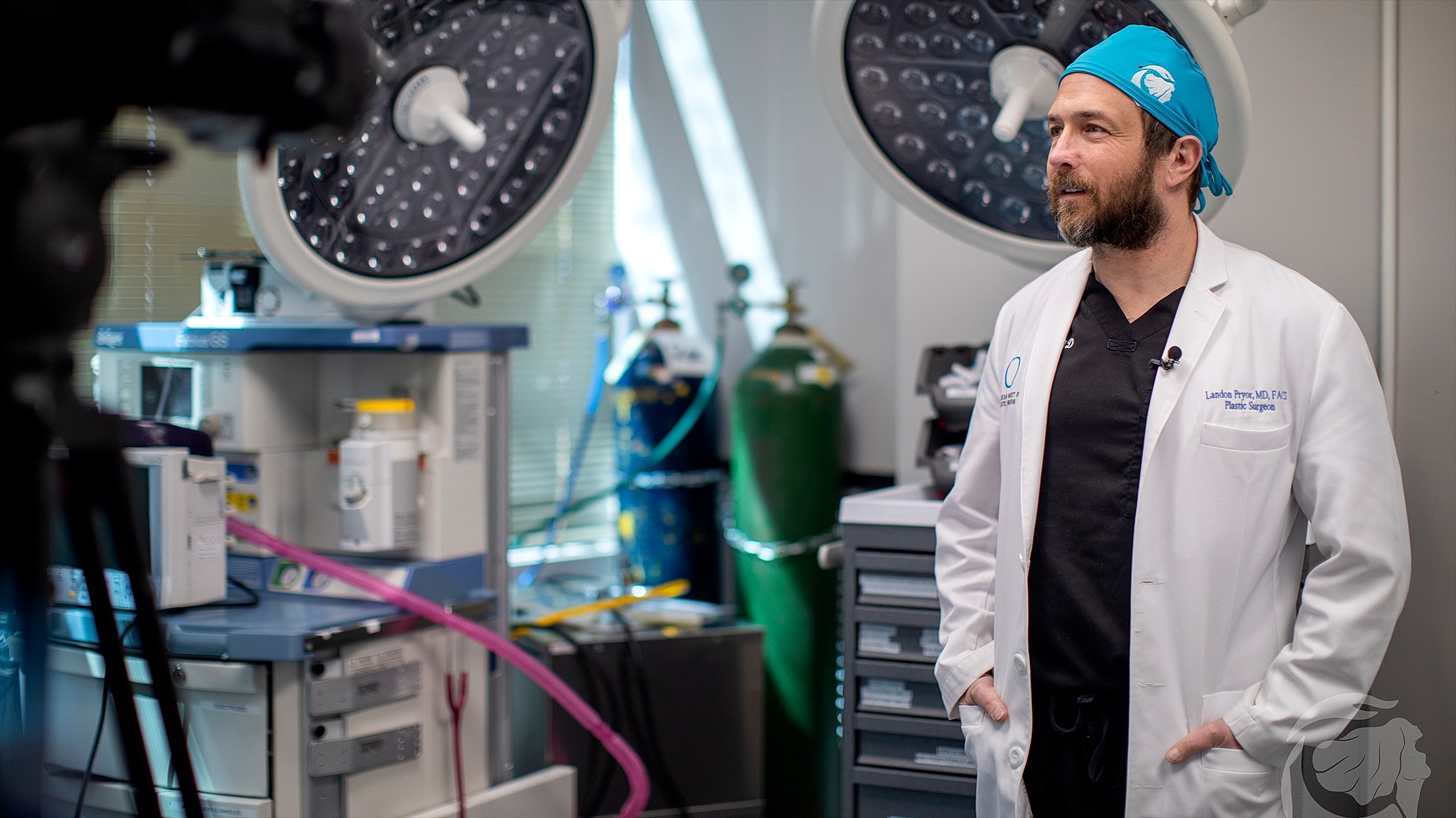 Woman holding silicone breast implants in both hands.